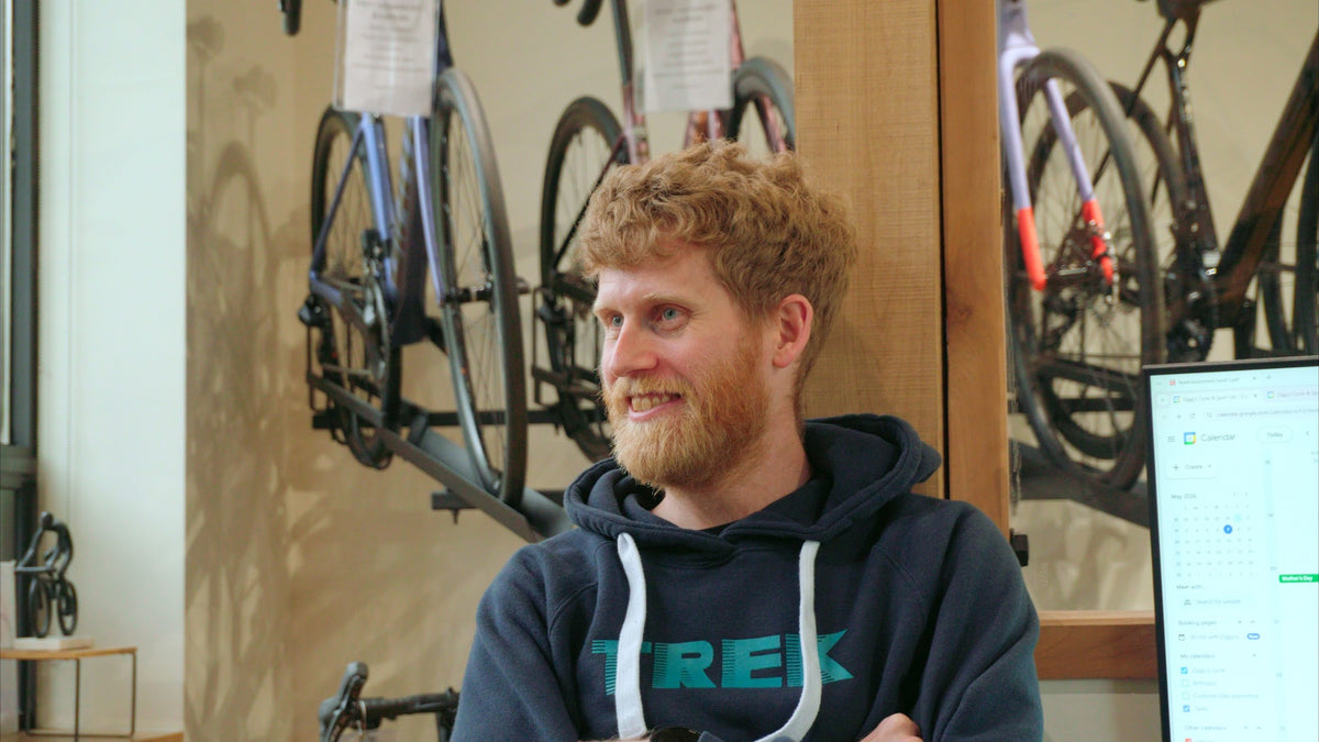 Alex adjusting a rider’s position on the trainer.
